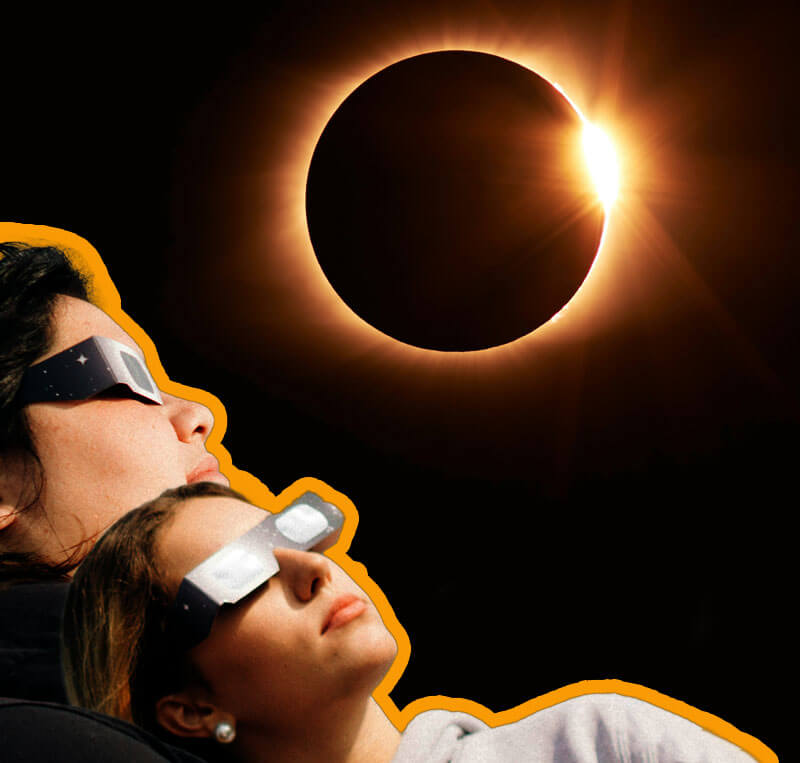 People wearing eclipse glasses as the watch the solar eclipse