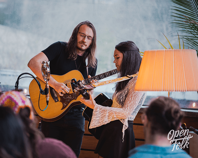 Anterra and Peter Stone performing with vocals and guitar