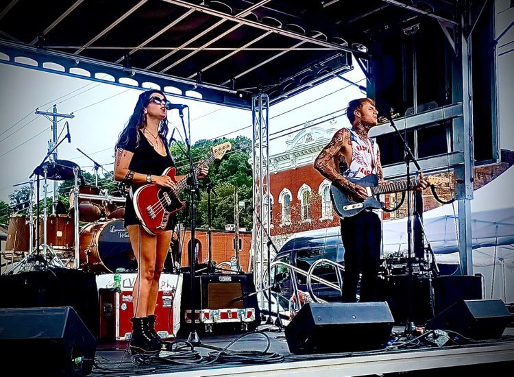 Kelly Ravin and Halle Jade performing on stage