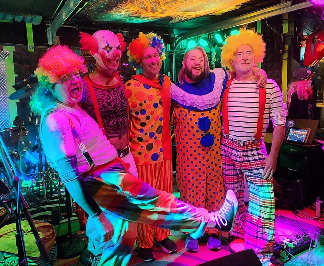 Five guys in clown costumes